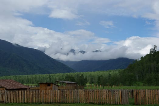Mountain landscape. Highlands, the mountain peaks, gorges and valleys. The stones on the slopes.