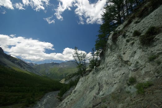 Mountain landscape. Highlands, the mountain peaks, gorges and valleys. The stones on the slopes.