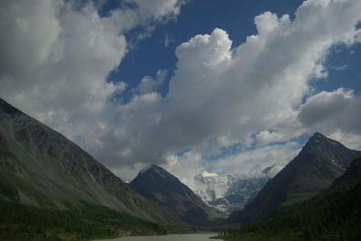 Mountain landscape. Highlands, the mountain peaks, gorges and valleys. The stones on the slopes.