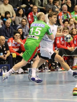 Cosmin Grigoras (Tatabanya -right) and Yves Grafenhorst (SC Magdeburg -left) in the EHF Cup match SC Magdeburg-Tatabanya KC on 19.2.17 in Magdeburg