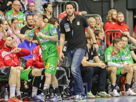 Austrian handball player Robert Weber l(i.) and german Headcoach Bennet Wiegert (re.)  both SC Magdeburg in the EHF Cup game SC Magdeburg-Tatabanya KC on February 19, 2017 in Magdeburg