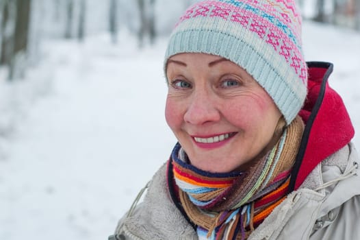 Portrait of a woman in a winter park