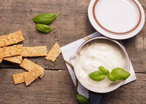 Organic cracker with sesame on a rustic wooden table
