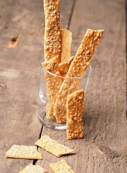 Organic cracker with sesame on a rustic wooden table