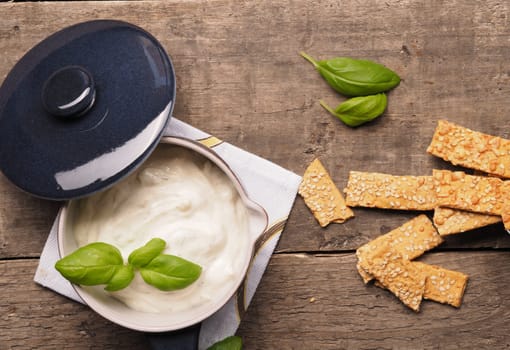 Organic cracker with sesame on a rustic wooden table