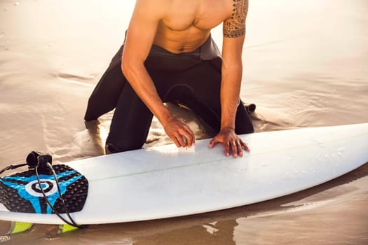 A surfer getting ready for the surf