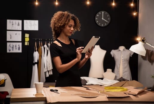 Two young entrepreneur women, and fashion designer working on her atelier