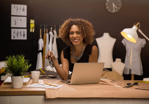 Two young entrepreneur women, and fashion designer working on her atelier
