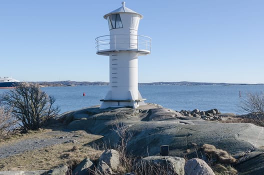 one lighthouse on sweden west-coast standing on a cliff
