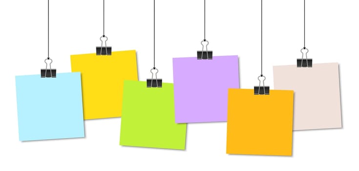 empty colored papers with binder clips hanging at black twine
