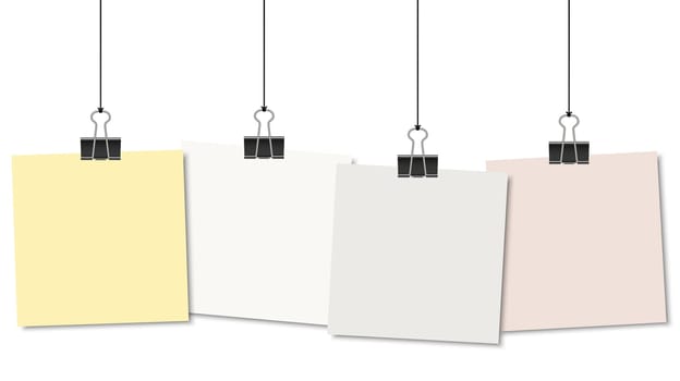 empty colored papers with binder clips hanging at black twine
