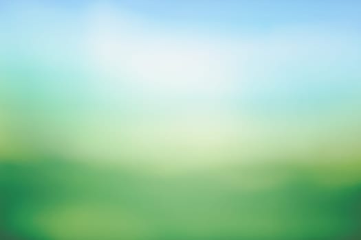 Sunny green meadow natural bokeh background