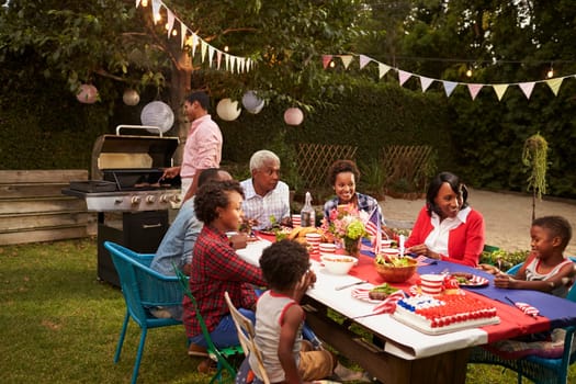 Multi generation black family having a 4th July barbecue