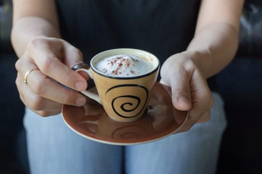 Woman Hand Hold Hot Macchiato Cup, stock photo