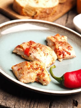 Wild salmon with chili and garlic, selective focus on foreground