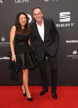 Hugo Egon Balder with girlfriend Elena.Presentation of the GOLDEN CAMERA 2017 at Messe Hamburg