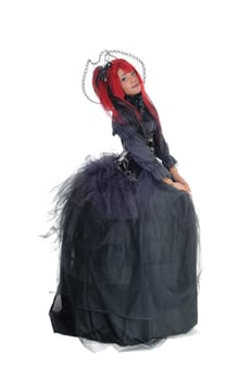 A young beautiful African American woman standing in a long black.Victorian dress and red hair, isolated for white background..