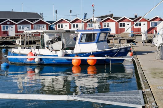 one little fishing boat in the harbour wait to go out and fish