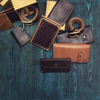 Men's accessories on a blue wooden background, top view