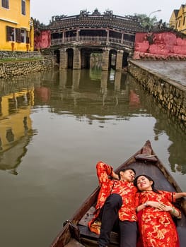 Hoi An, Vietnam - Dec 28, 2016: Wedding photo shoot on the Thu Bon river. Its beauty and charm makes it popular with photographers.