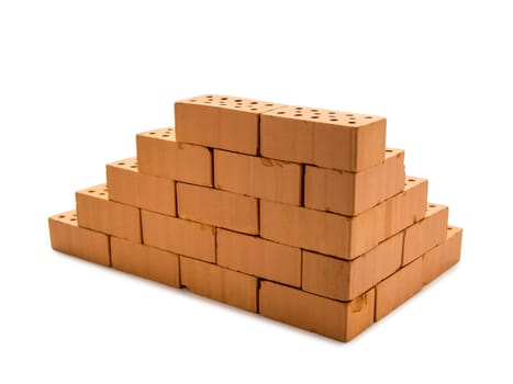 indicated masonry of toy bricks with a 20 euro banknote behind it on a white background