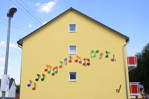 A house façade with painted colorful notes.