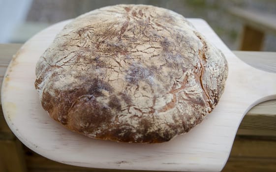 one lovely home made bread ready to eat wiht butter on