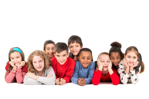 Group of happy children posing isolated in white