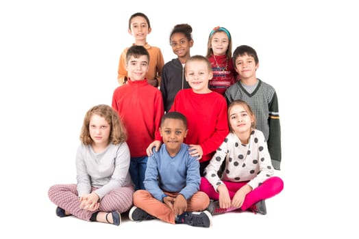 Group of happy children posing isolated in white