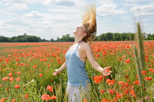 Woman in the poppy field