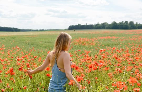 Woman in the poppy field