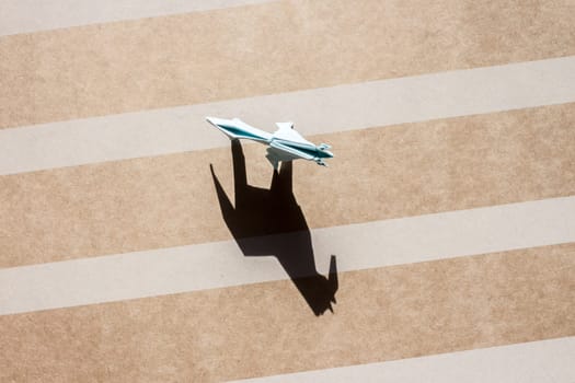 origami blue horse and shadow on paper field top view