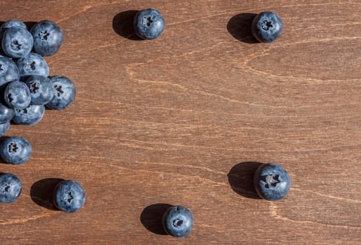fresh big delicious blueberries wooden background free space for text