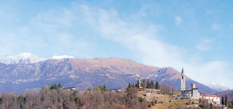 Mountain landscape with castle and belfry. Artegna , Friuli Italy