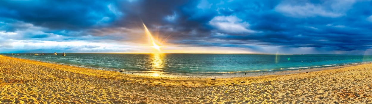 White sandy Flic en Flac beach at sunset. Mauritius. Panorama