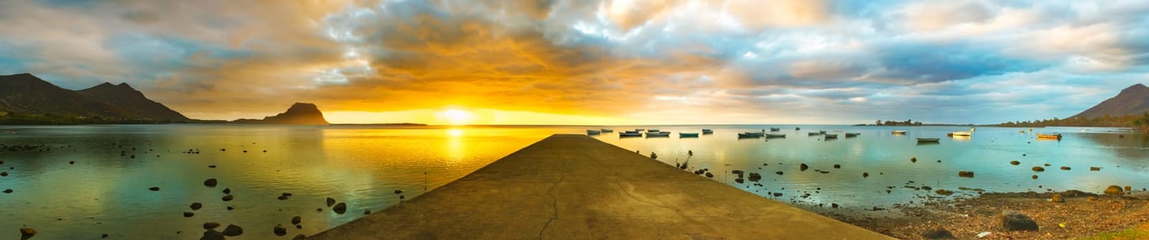 Sunset over sea. Le Morn Brabant on background. Mauritius. Panorama