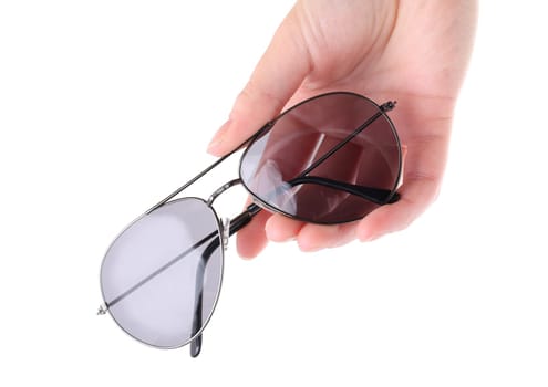 Hand holding gray sunglasses isolated on white background