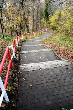 Stairs on the hill in autumn park