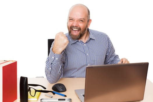 A man in winning pose in his Buero against a white background