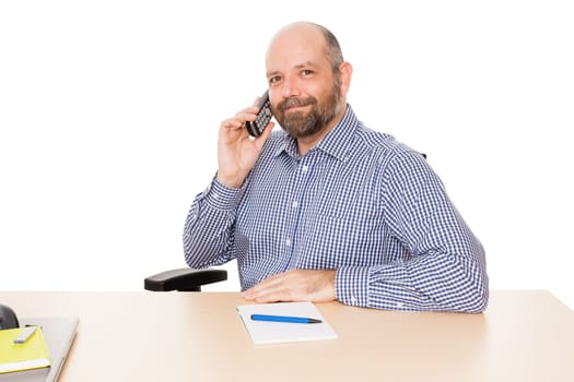 A business man on the phone against a white background