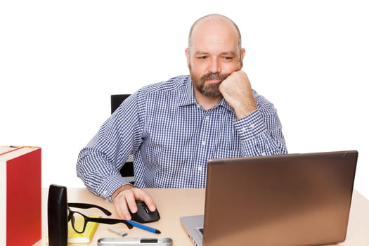 A bored man in his buero against a white background