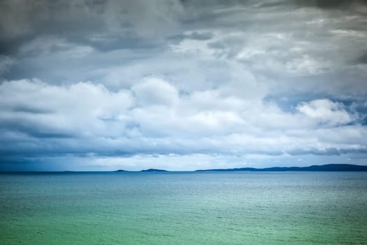 The view of a sea under cloudy skies