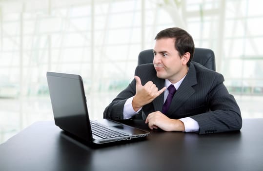 businessman working with is laptop, at the office