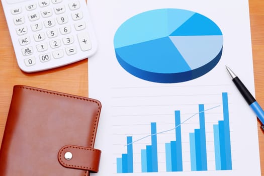 Color chart printed documents with pen and notebook, calculator on the table