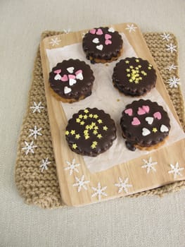 Filled double biscuits with chocolate
