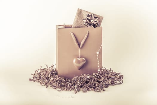 Wonderful vintage gift with a card inside, maybe voucher or concert tickets for Valentine's Day or Mother's Day.