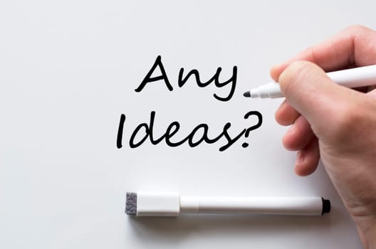 Human hand writing any ideas on whiteboard