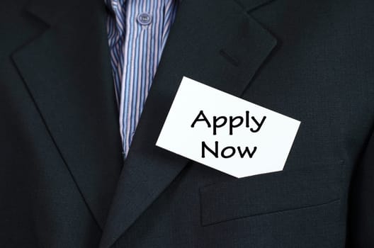 Apply now text note concept over business man background.