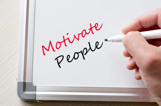 Human hand writing motivate people on whiteboard