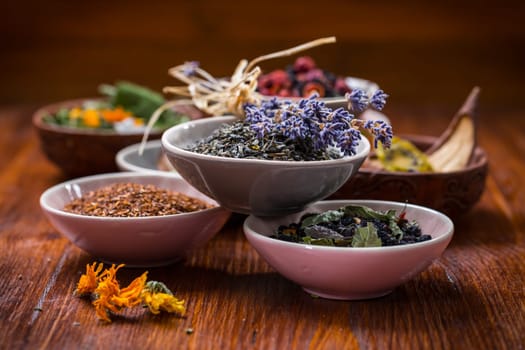 Assortment of herbal and fruit tea in bowls